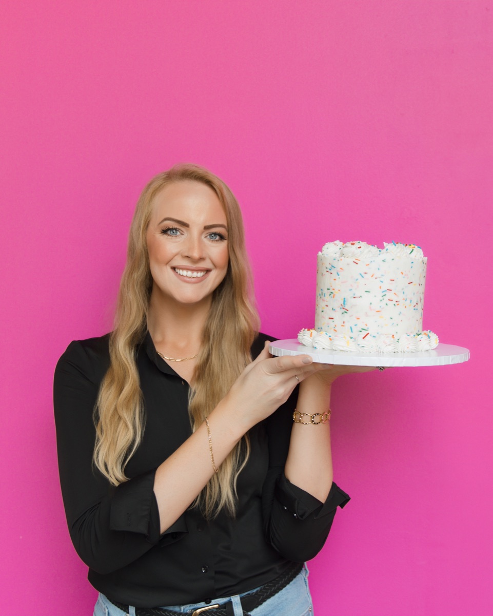 Rachel holding a funfetti layer cake