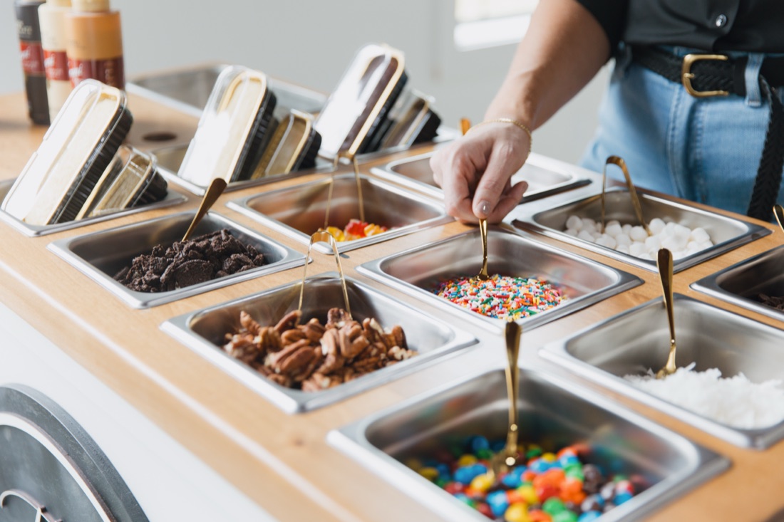 The Trolley topping bar filled with sprinkles, candy, and sauces