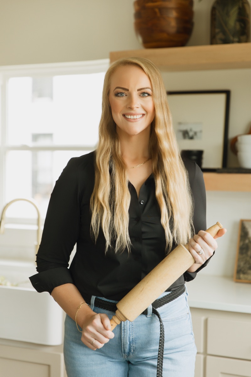 Rachel Parker holding a rolling pin in her kitchen