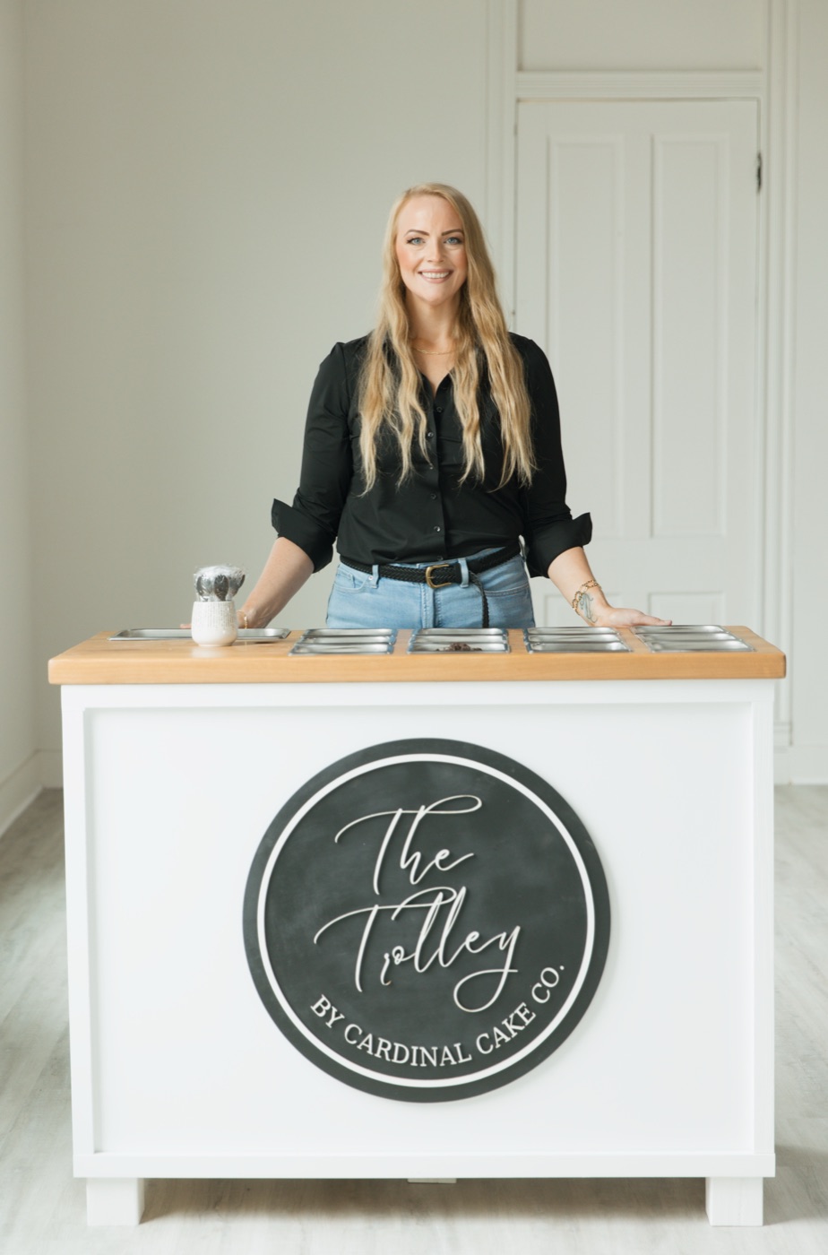 Rachel behind The Trolley, Cardinal Cake Co.'s mobile cake bar cart